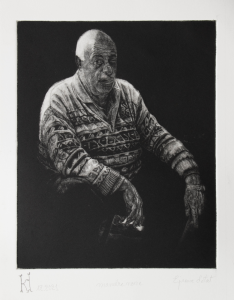 006. Man Sitting Wearing a Patterned Sweater 